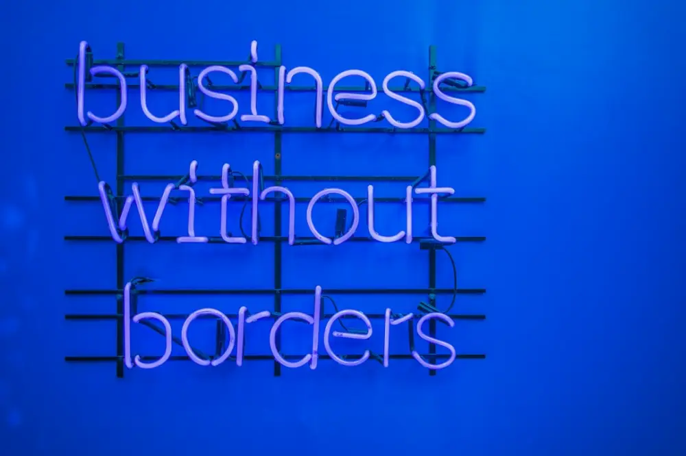 A neon sign that says business without borders, illustrating business welfare standards